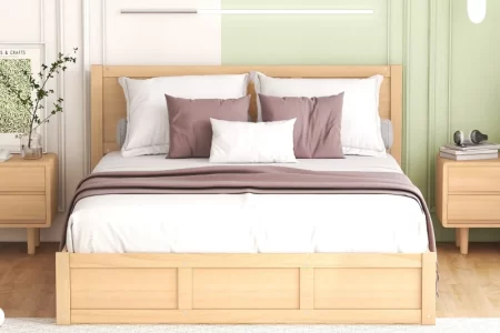 Natural wood storage bed against pastel green wall