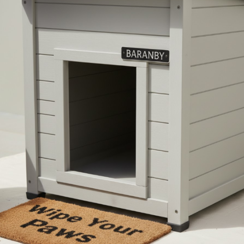 Customized dog house with nameplate and welcome mat placed at the entrance.
